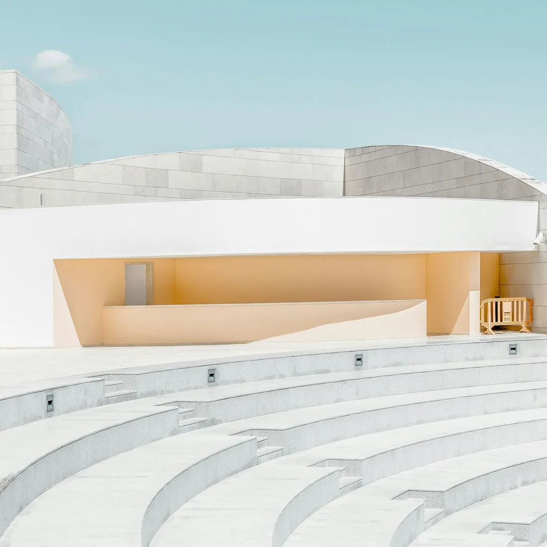 A concrete block stair and wall, its coursing running the full width of the frame