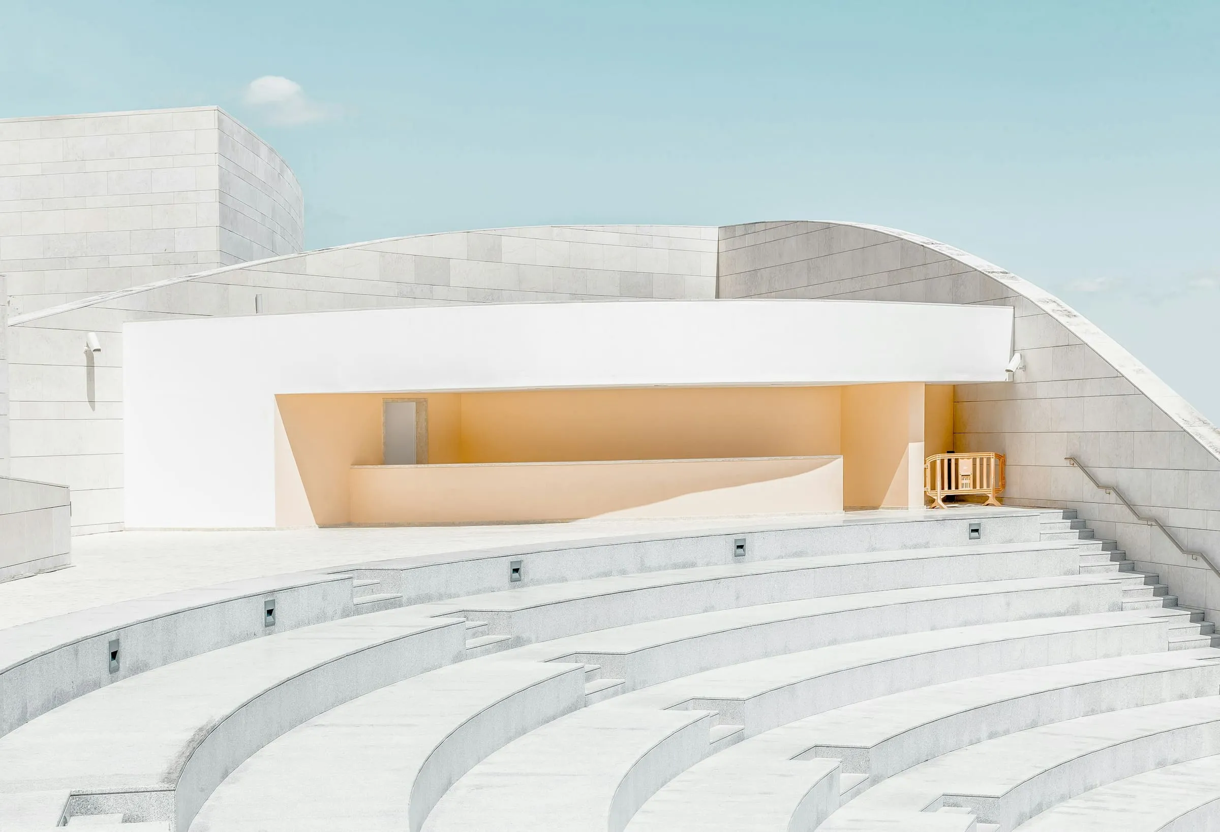A concrete block stair and wall, its coursing running the full width of the frame