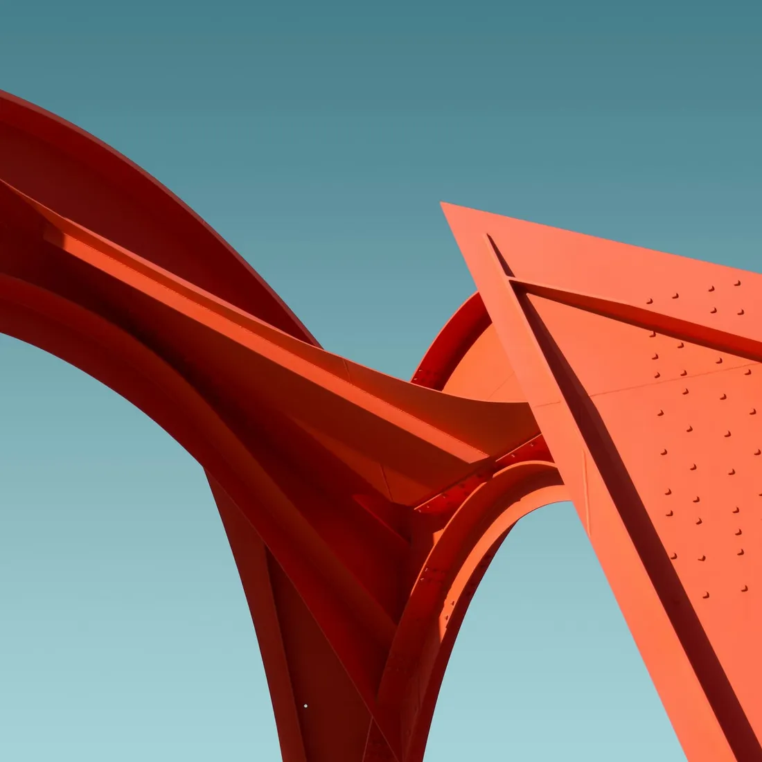 A sculptural roof form standing clear against an empty sky