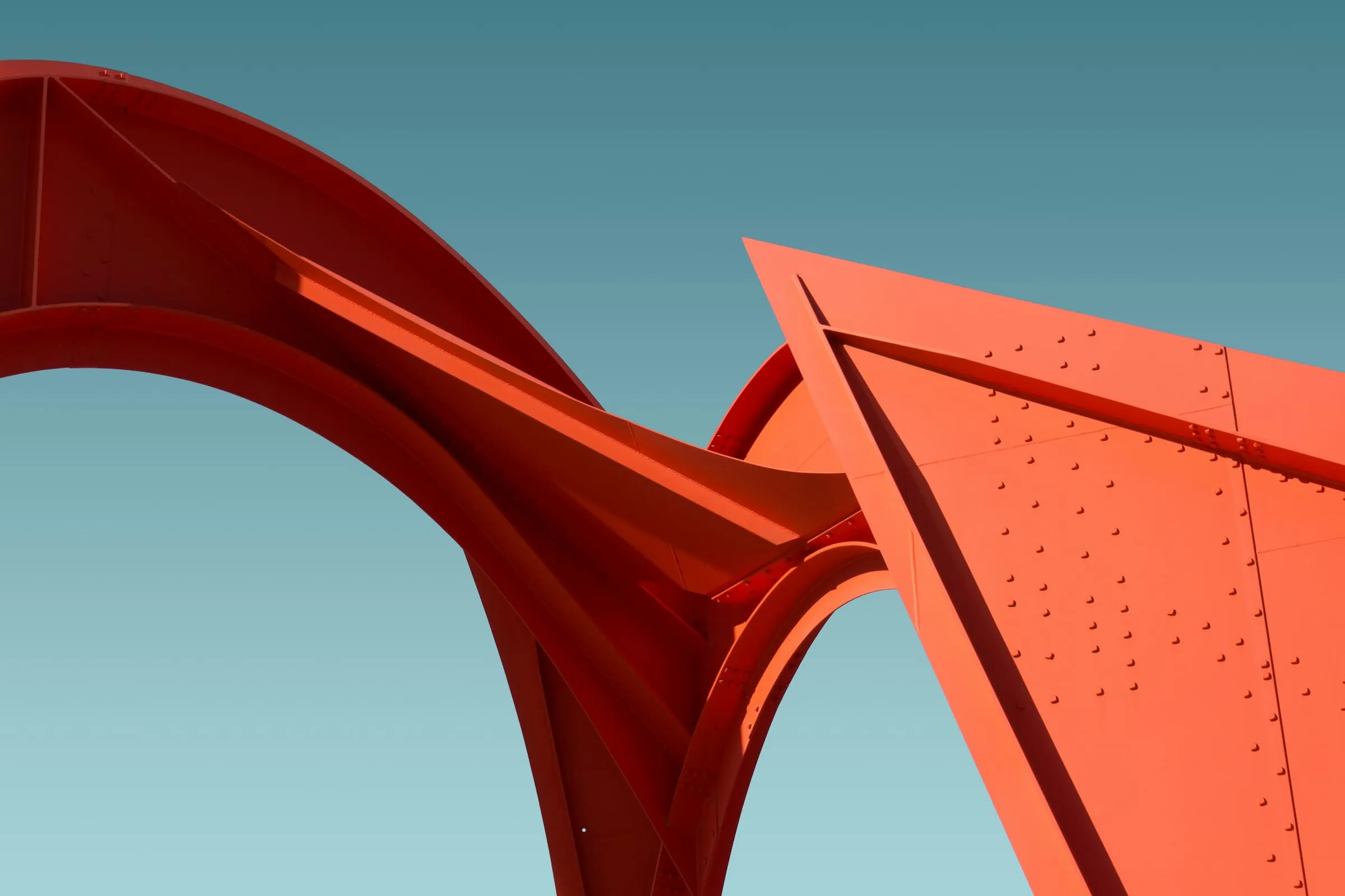 A sculptural roof form standing clear against an empty sky